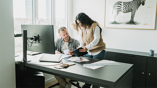 Couple behind a desk